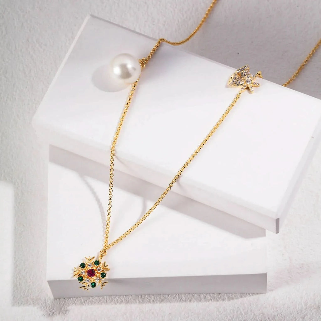 A gold necklace elegantly displayed on a white stand, featuring a sunburst pendant with multicolored gemstones at the center and a large, solitary pearl. The chain is simple, ensuring that the focus remains on the intricate design of the pendant and the pearl, signifying a blend of modern luxury and classic beauty.