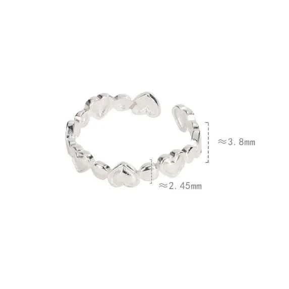 Silver ring with heart-shaped beads 