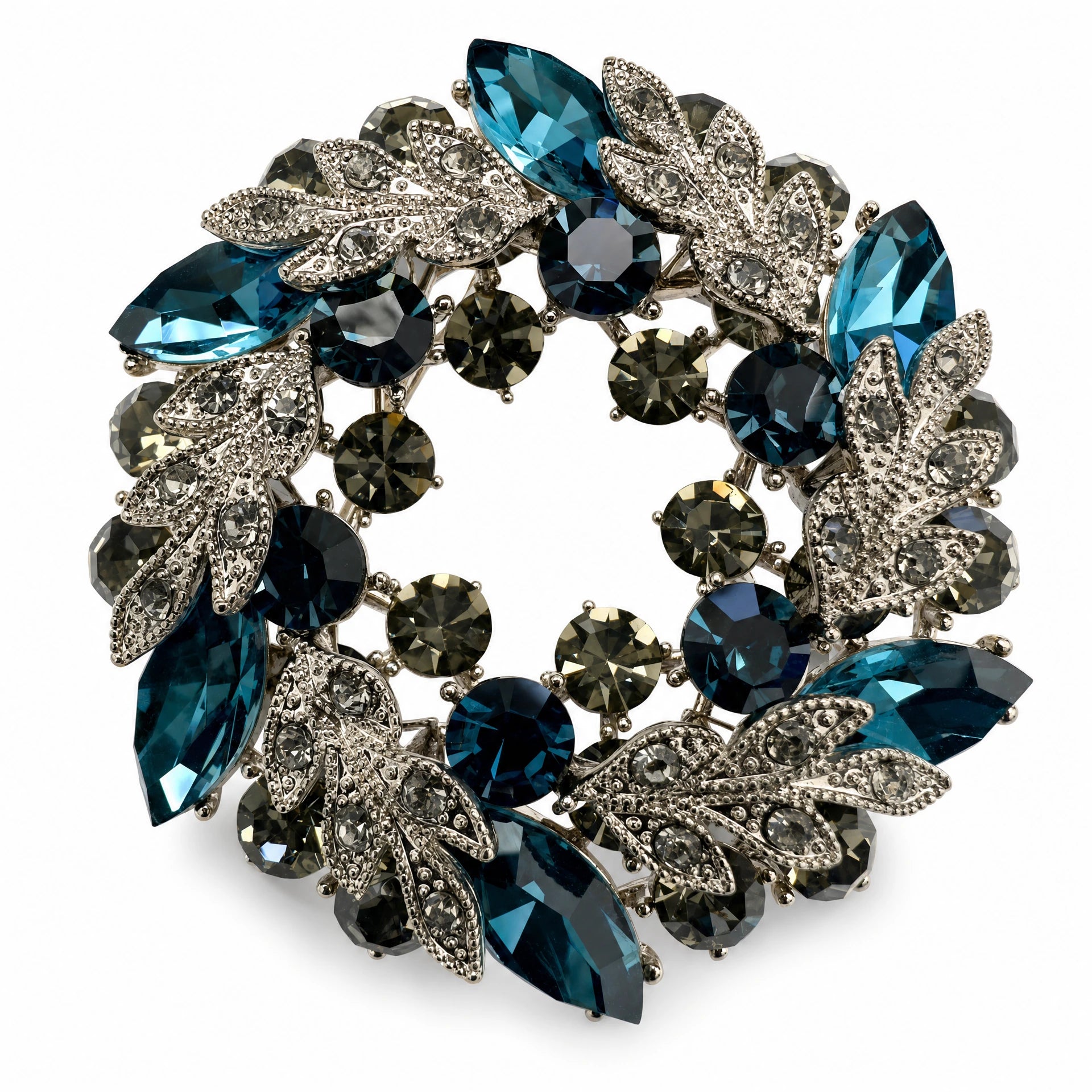 Teal Blue crystal leaf wreath brooch on a white background