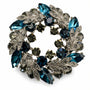 Teal Blue crystal leaf wreath brooch on a white background