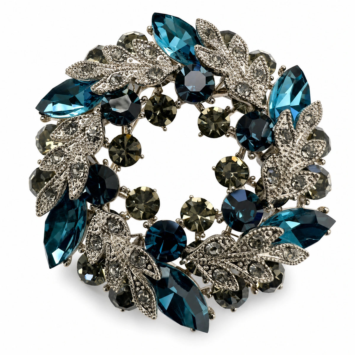 Teal Blue crystal leaf wreath brooch on a white background