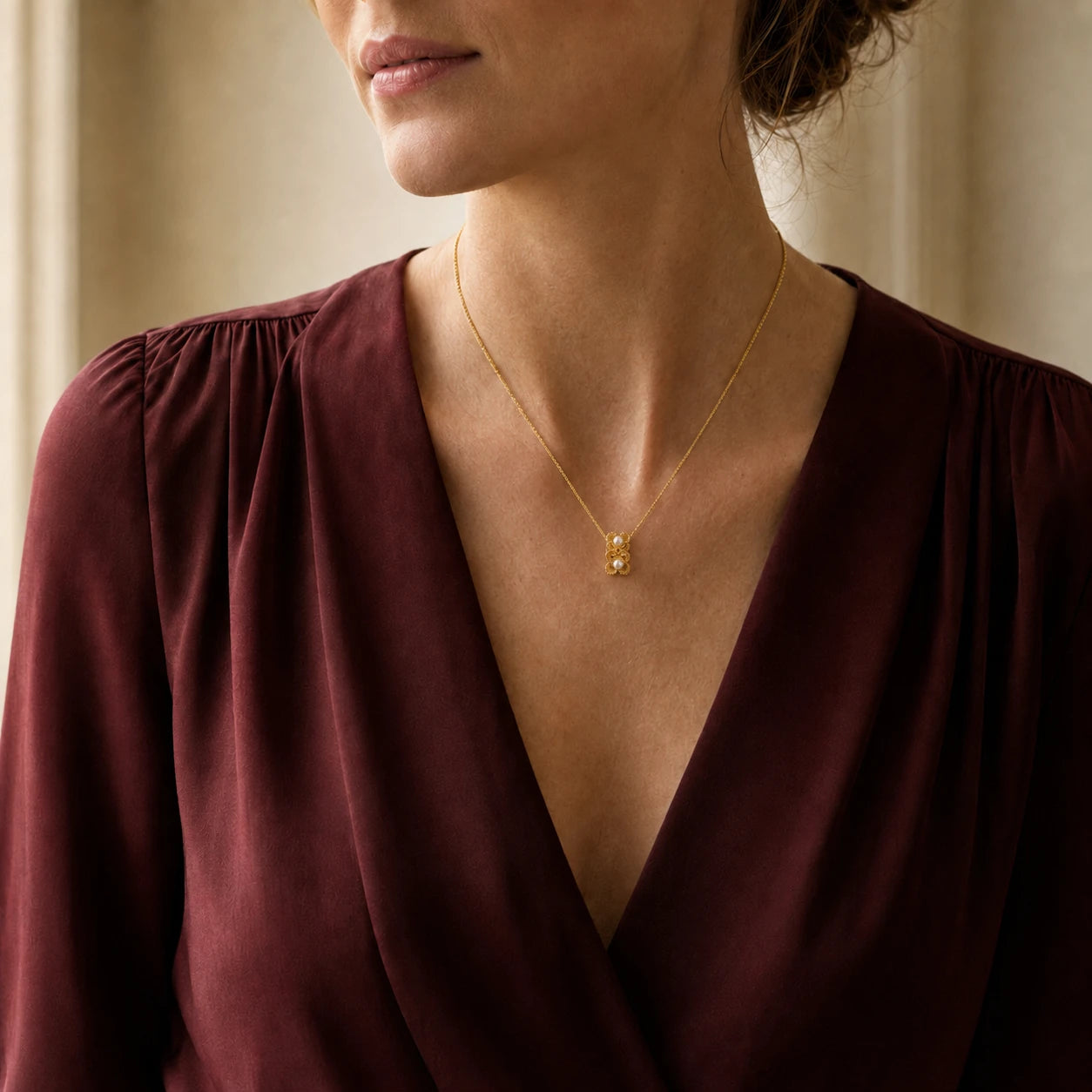 Model wearing gold-tone beaded double flower pearl pendant necklace