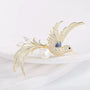 Crystal bird brooch with clear feather details, deep blue enamel wing and pearl-effect accent