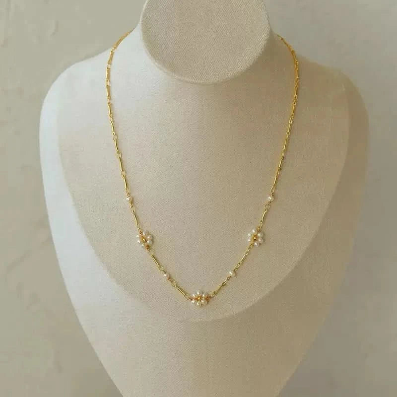 Gold necklace on a mannequin bust 