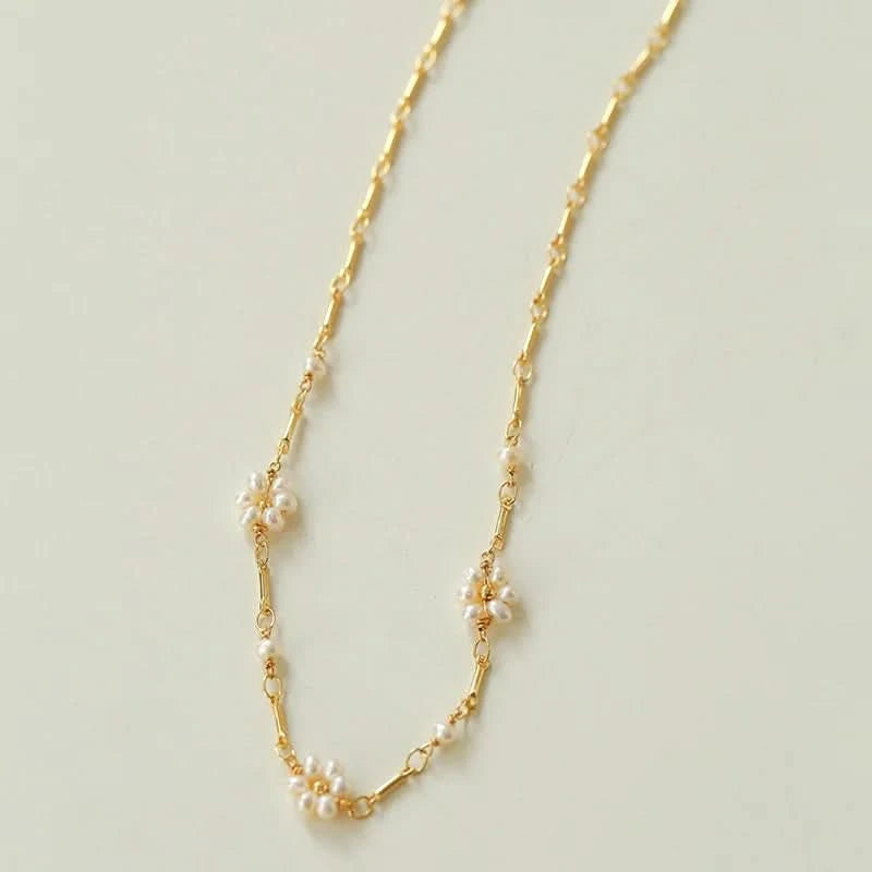 Gold necklace with small pearls 
