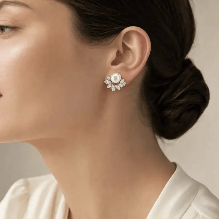 Close-up of natural freshwater pearls and clear crystal leaf details