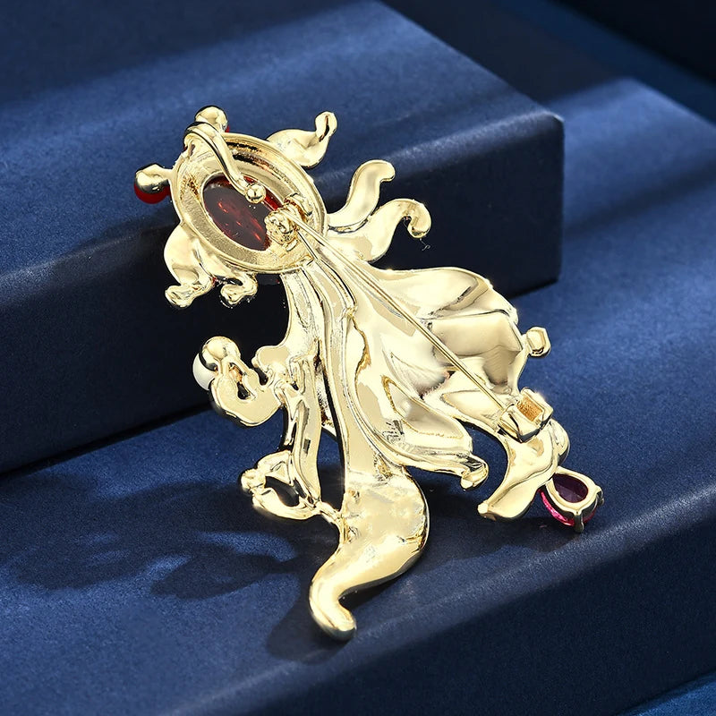 Back of gold-tone orange enamel goldfish brooch with secure pin fastening