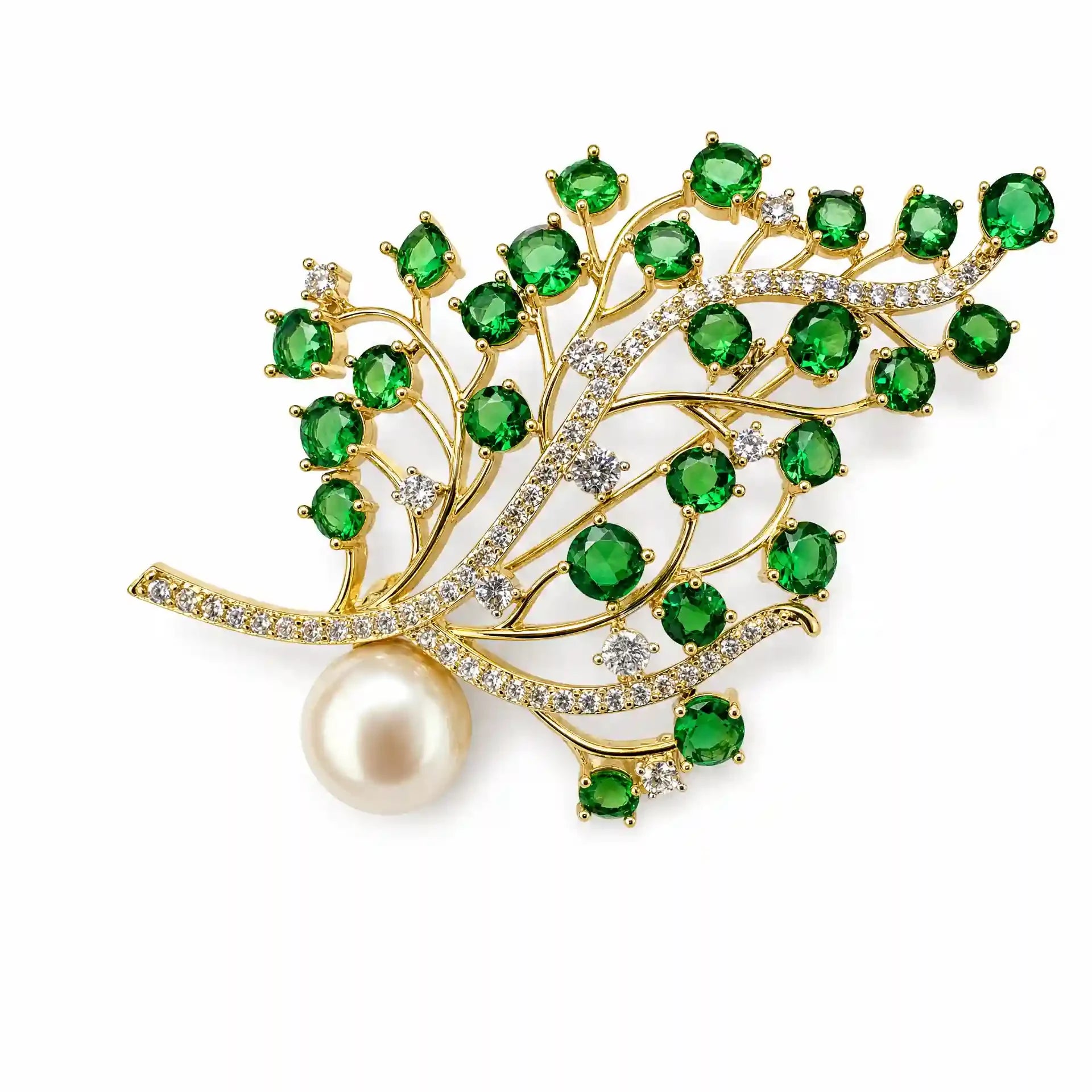 Green crystal branch brooch with clear crystals, pearl accent and gold-tone setting on a white background