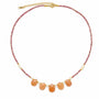 Pink tourmaline and sunstone teardrop necklace with freshwater pearl accents on a white background