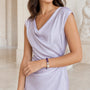Amethyst chip and baroque pearl bracelet worn with a lavender dress
