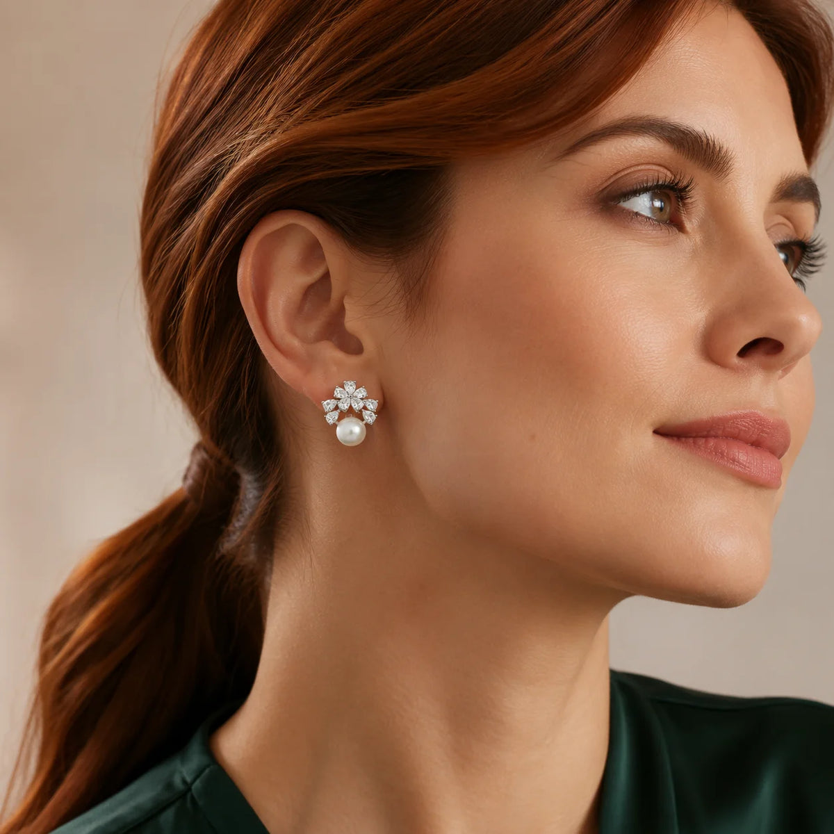 Model wearing gold-tone freshwater pearl floral cluster stud earrings with clear zircon petals