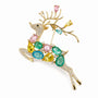 Multicolour crystal reindeer brooch in a leaping pose with gold-tone antlers on a white background
