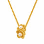Close-up of two stacked gold-tone flowers with beaded petals and pearl-style centres