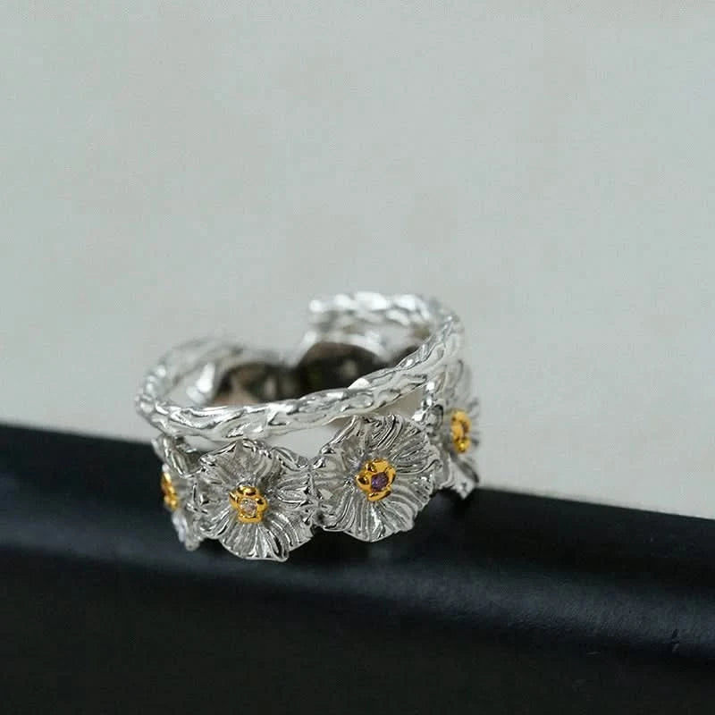 Silver ring with floral designs