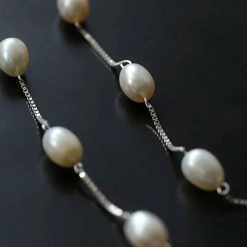 Pearl necklace on a dark background