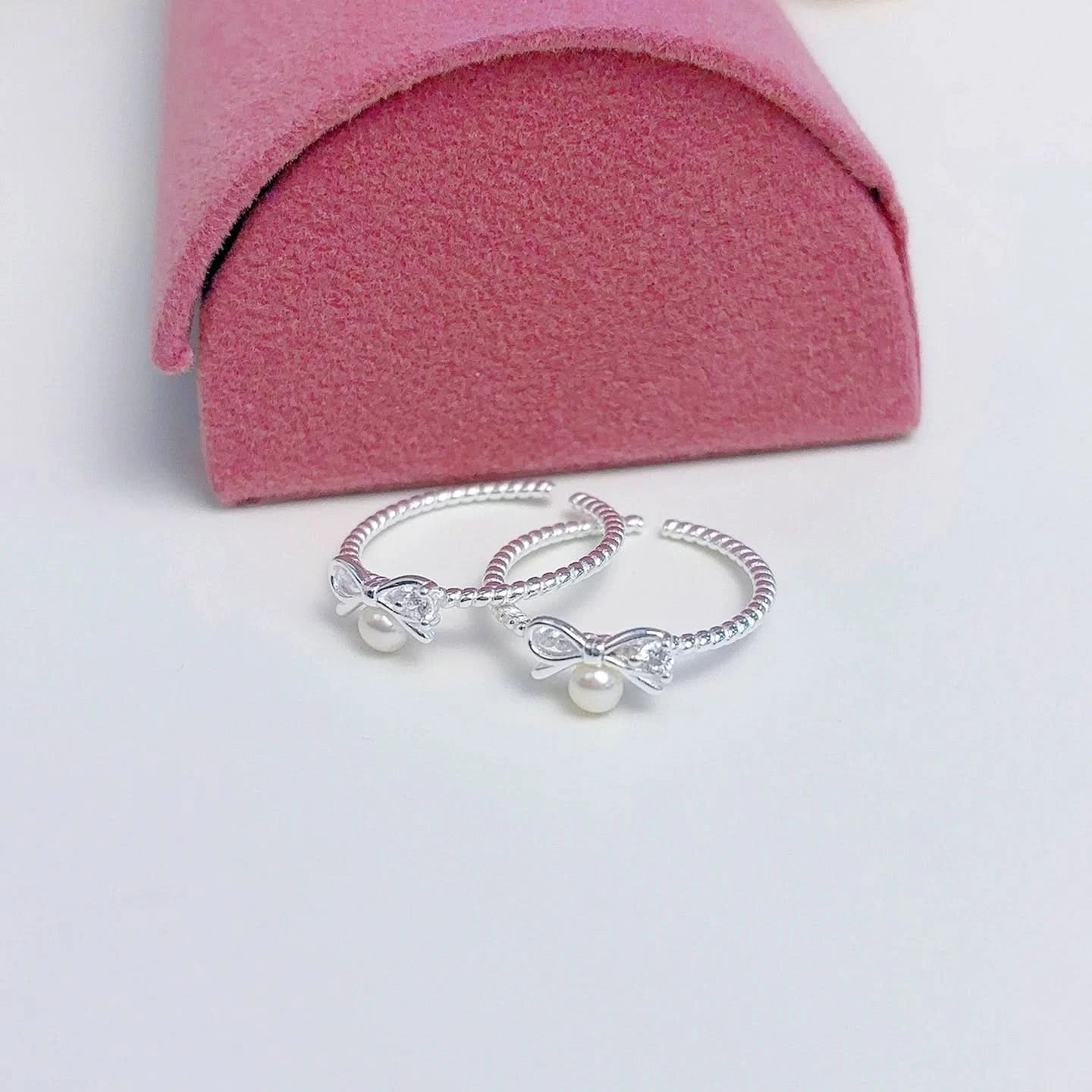 Sterling silver bow freshwater pearl ring