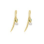A pair of gold snake earrings with a sleek, textured scale design, featuring green crystal eyes and a single white pearl suspended at the bottom of each earring. The design is modern and minimalist, with a smooth, curved silhouette that mimics the shape of a snake in motion.