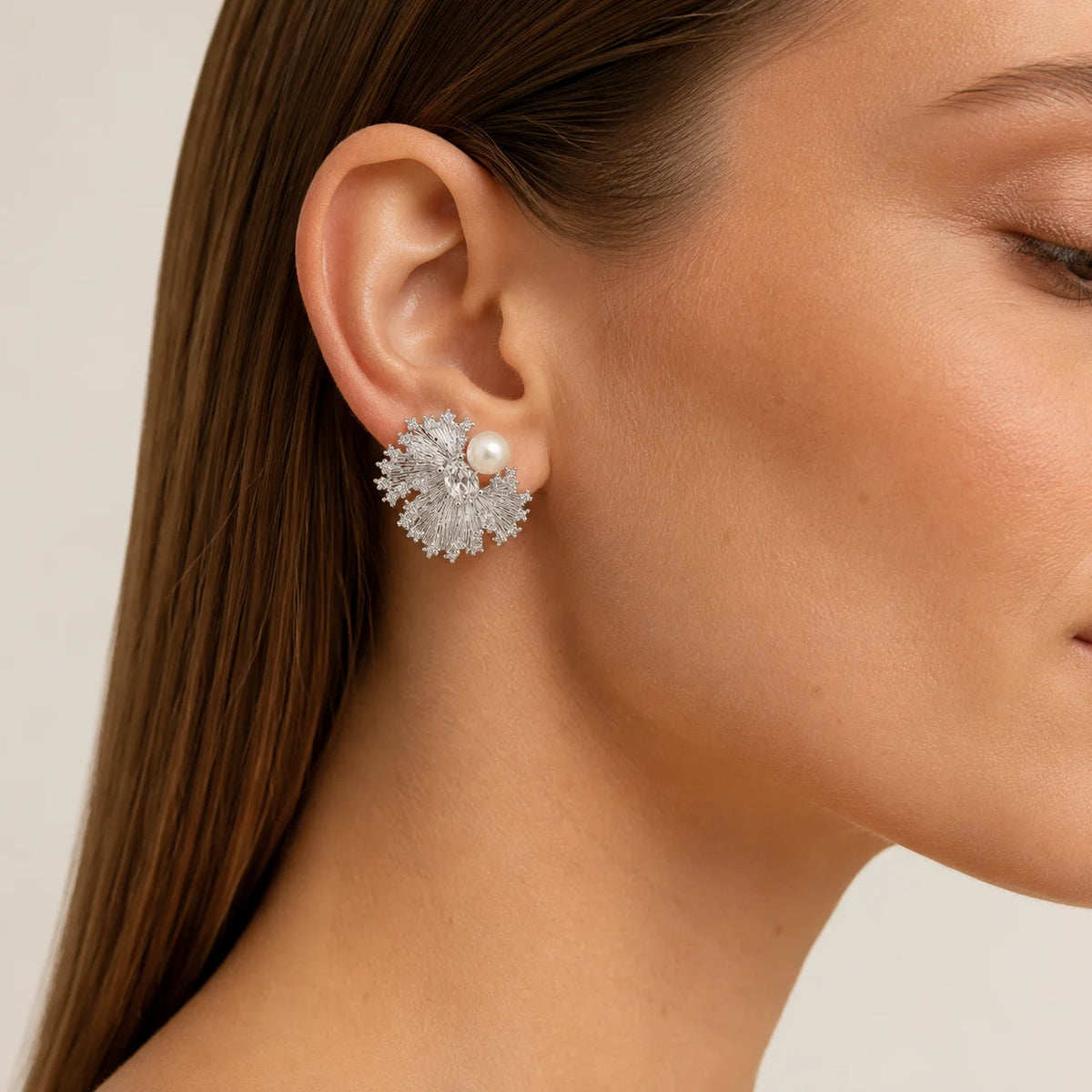 Model wearing silver-tone freshwater pearl crystal fan stud earrings