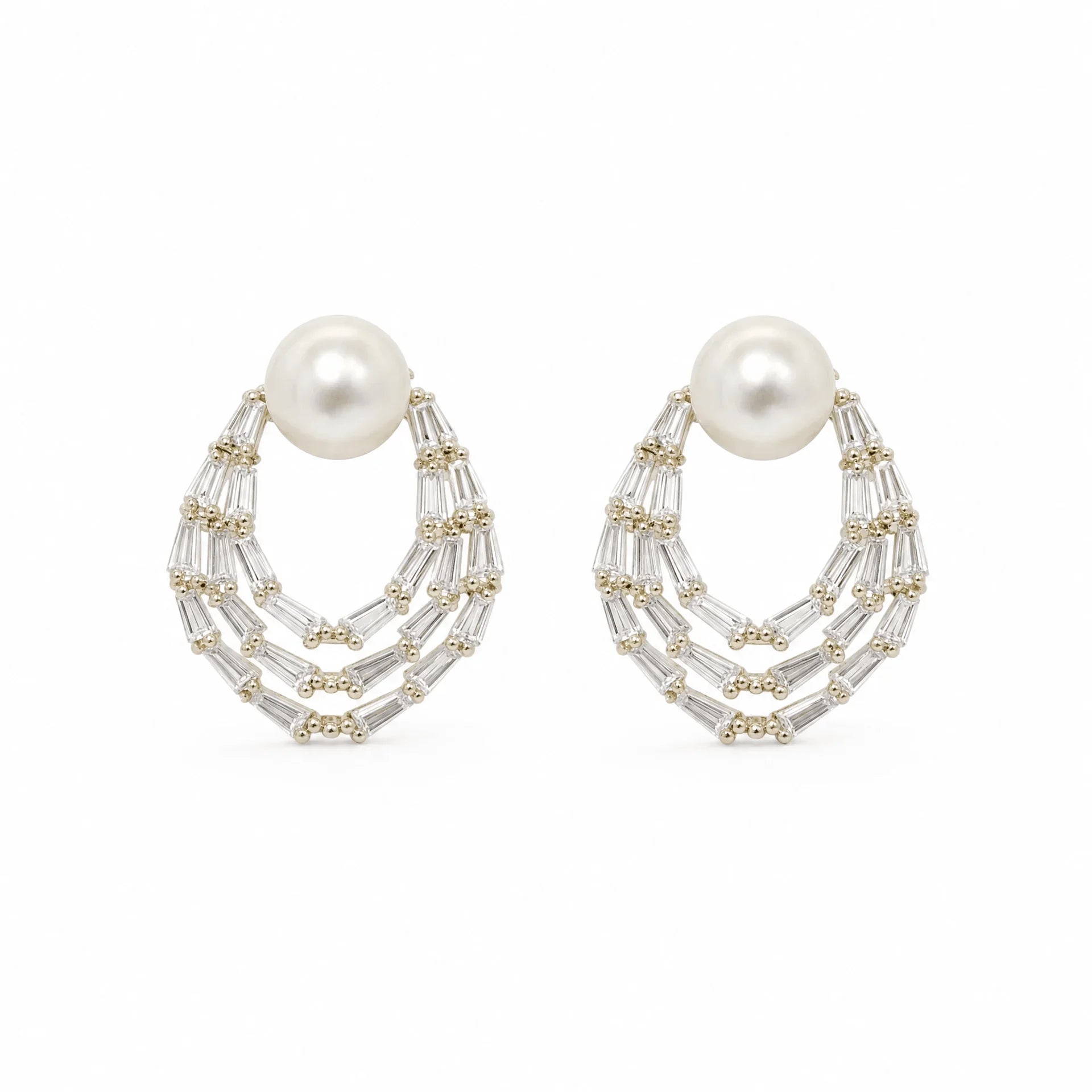 Gold-tone freshwater pearl stud earrings with layered baguette crystal teardrops