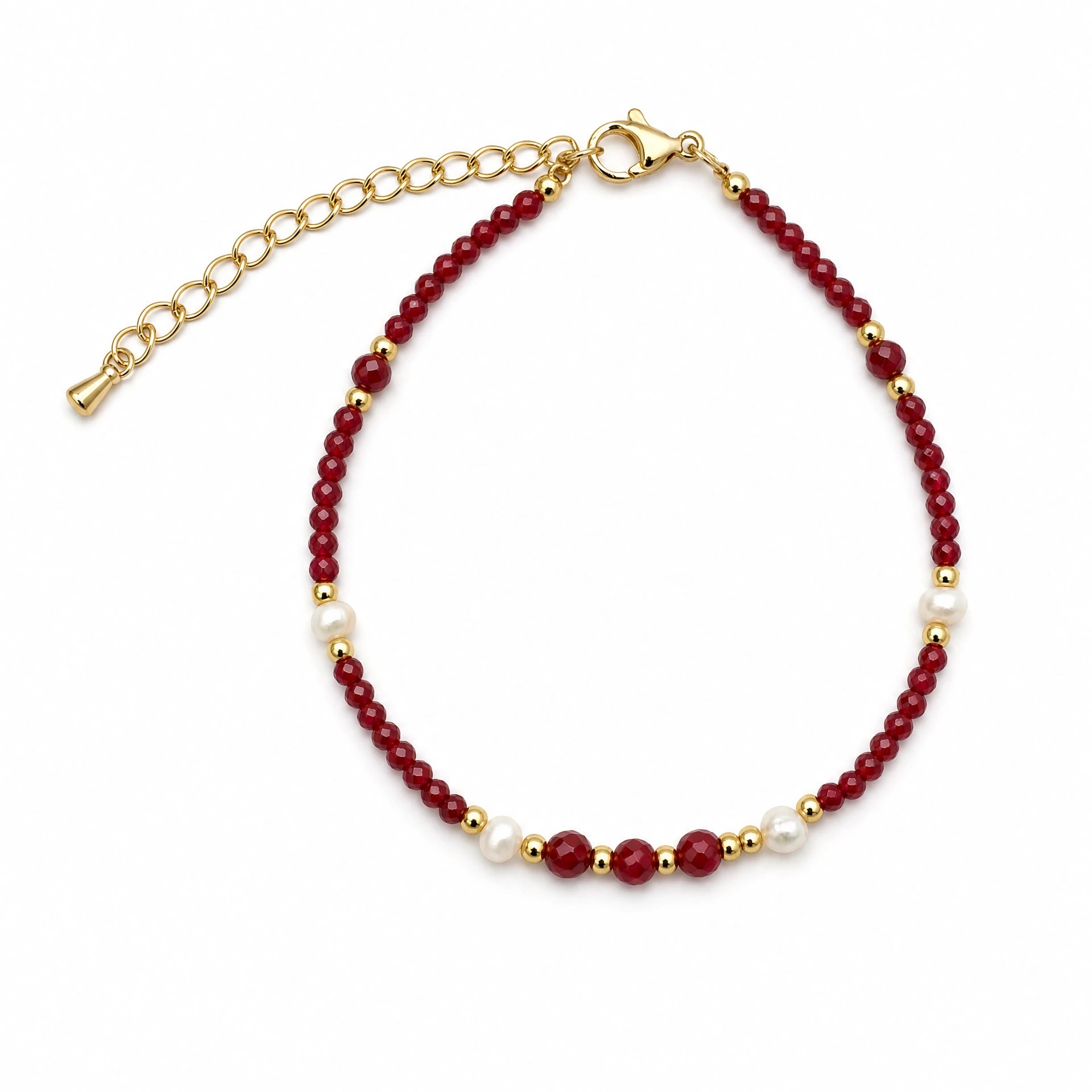 Red agate and freshwater pearl beaded bracelet on a white background