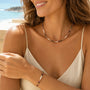 Multicolour tourmaline pearl necklace and matching bracelet worn at the beach