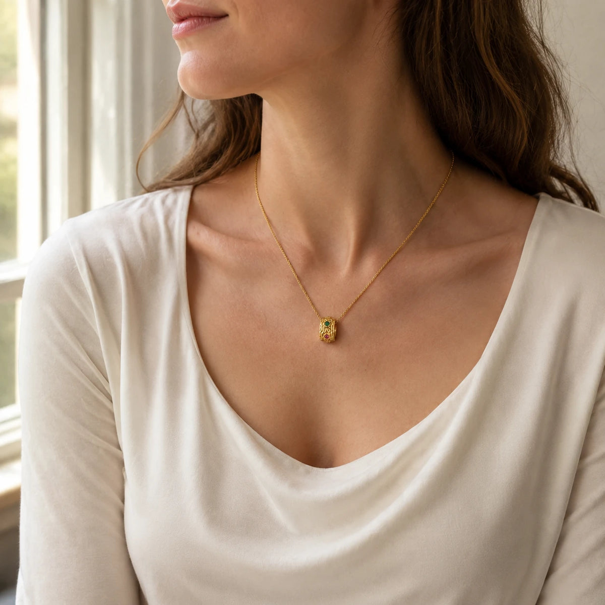 Model wearing gold-plated sterling silver multicolour barrel pendant necklace