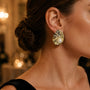 Model wearing gold-tone hammered freshwater pearl statement stud earrings