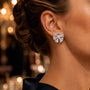 Model wearing sterling silver pearl flower stud earrings