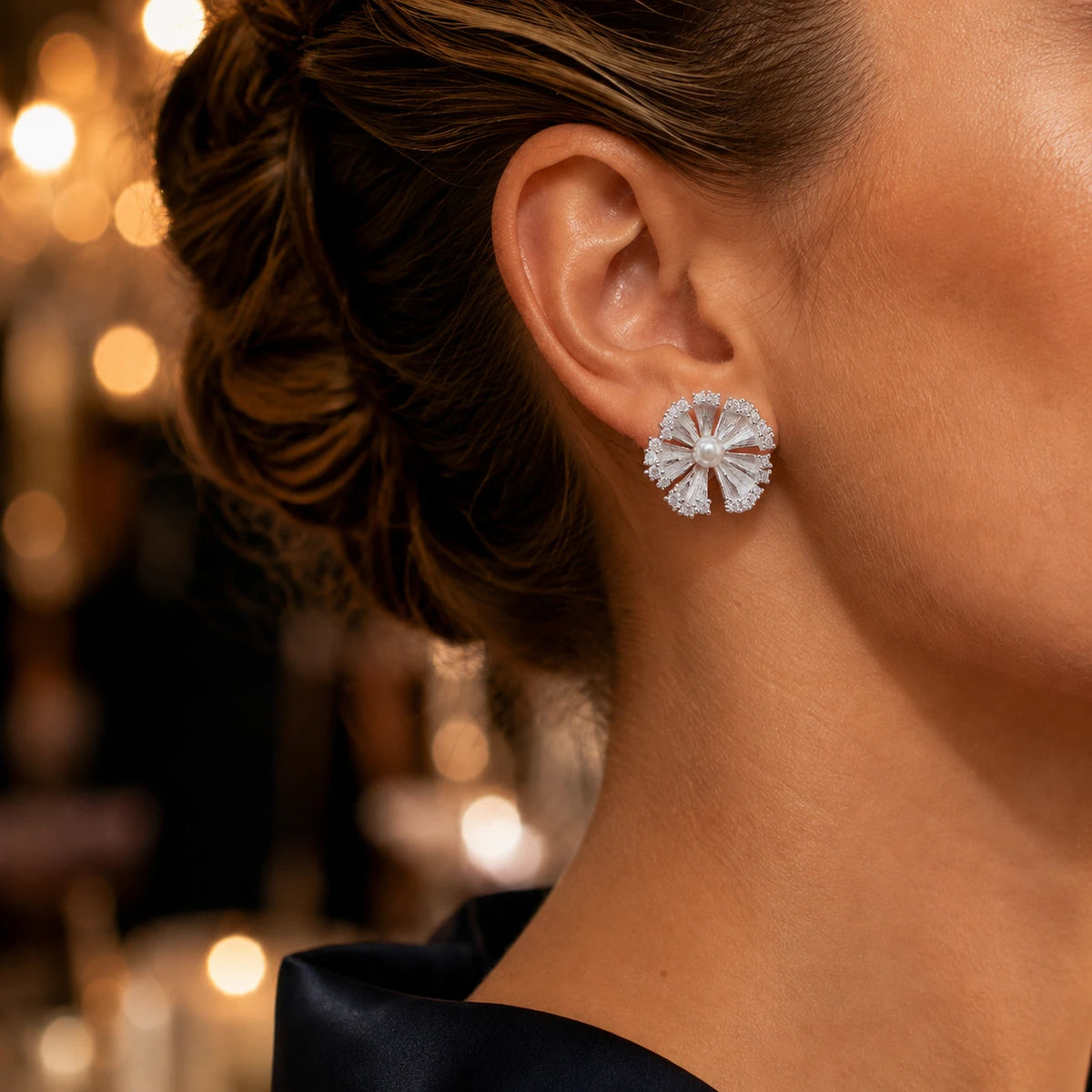 Model wearing sterling silver pearl flower stud earrings