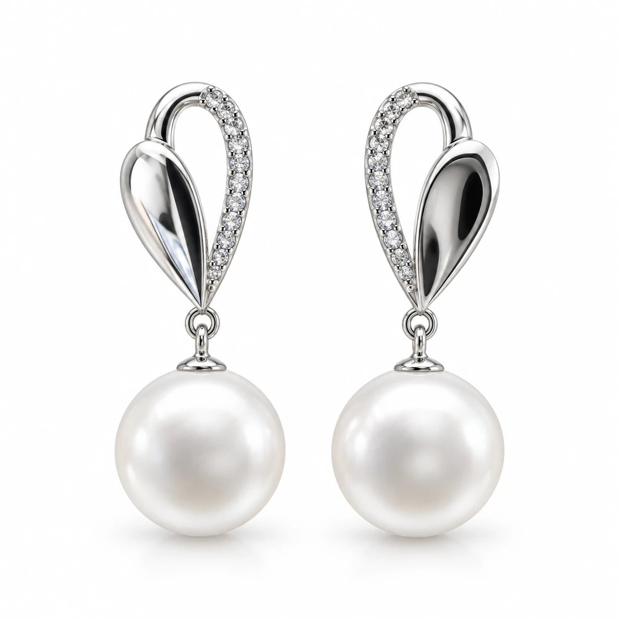 Silver sculpted drop earrings with oversized white pearls and clear pavé stones