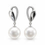 Silver sculpted drop earrings with oversized white pearls and clear pavé stones