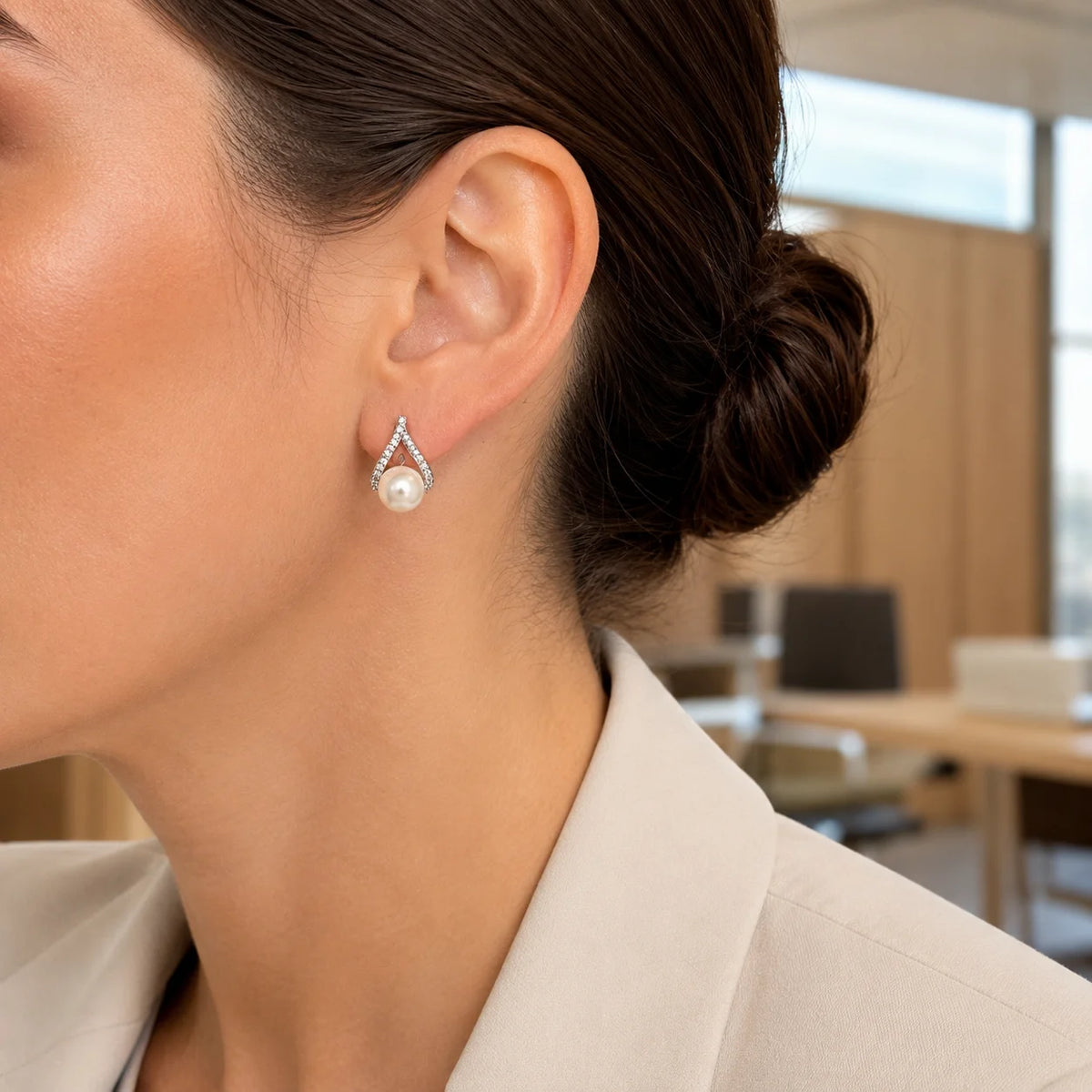 Model wearing silver-tone freshwater pearl crystal teardrop stud earrings