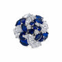Close-up of mixed-cut blue and clear zirconia arranged in layered floral petals