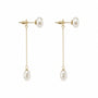 Close-up of S925 silver posts and chain-backed freshwater pearl drop earrings