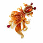 Orange enamel goldfish brooch with amber crystal body and flowing red tail on a white background