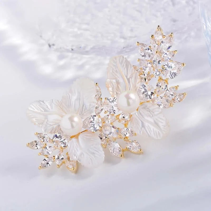 Close-up of translucent white flower petals, pearl accents and clear marquise crystals