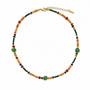 Mixed natural gemstone beaded necklace with green aventurine on a white background