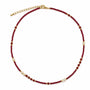 Red agate and freshwater pearl beaded necklace on a white background