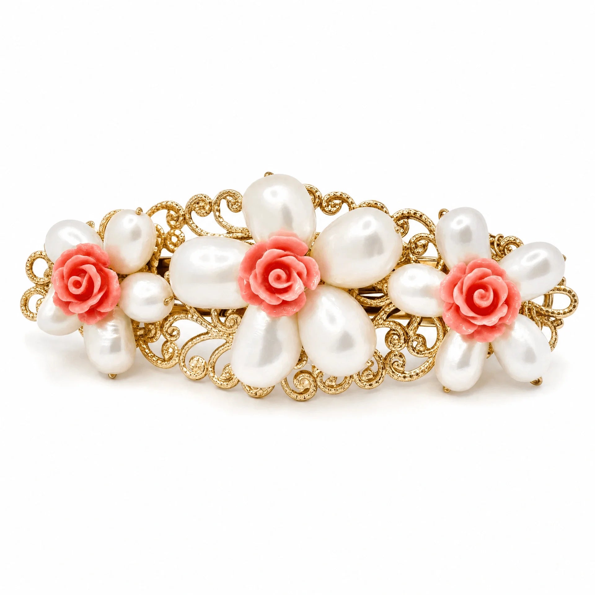 A vintage-style gold filigree hair clip decorated with faux white pearls and coral-pink rose accents, shown on a plain white background.