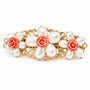 A vintage-style gold filigree hair clip decorated with faux white pearls and coral-pink rose accents, shown on a plain white background.