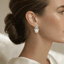 Close-up of marquise and pavé crystals above a white freshwater pearl