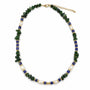 Green gemstone cobalt blue and baroque pearl beaded necklace on a white background