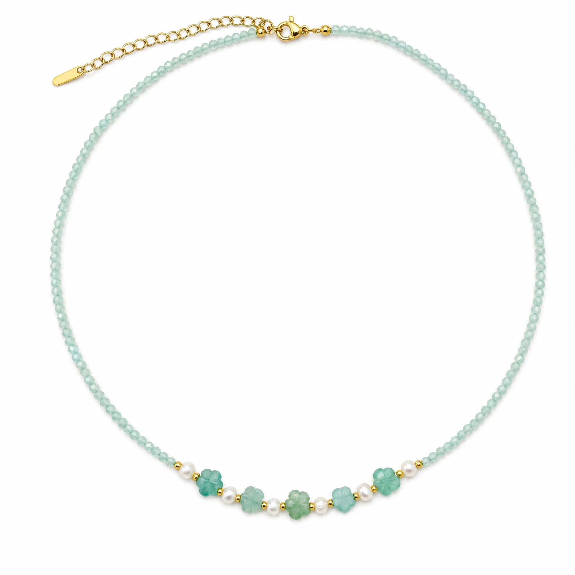 Amazonite beaded necklace with five carved flowers and freshwater pearl accents on a white background