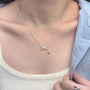 Silver necklace with a bow and pearl pendant 