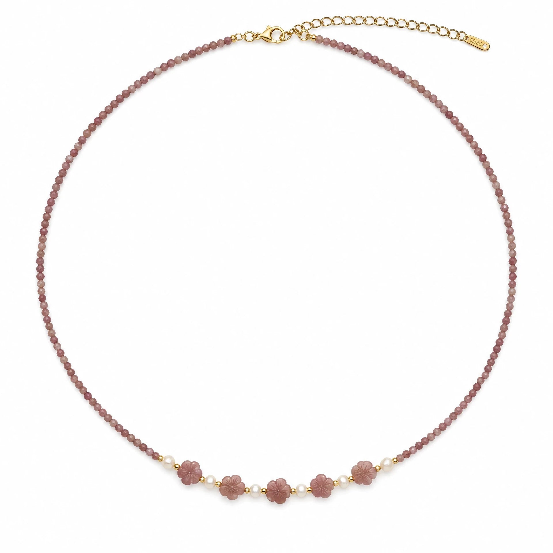 Rhodochrosite beaded necklace with five carved flowers and freshwater pearl accents on a white background