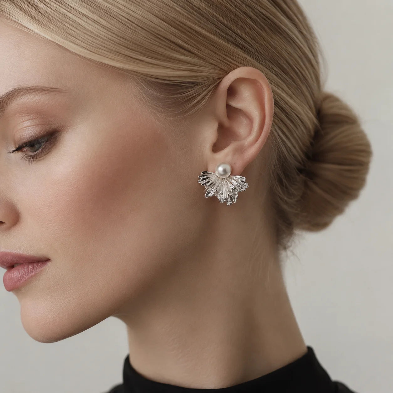 Silver-tone freshwater pearl stud earrings with layered textured fan petals