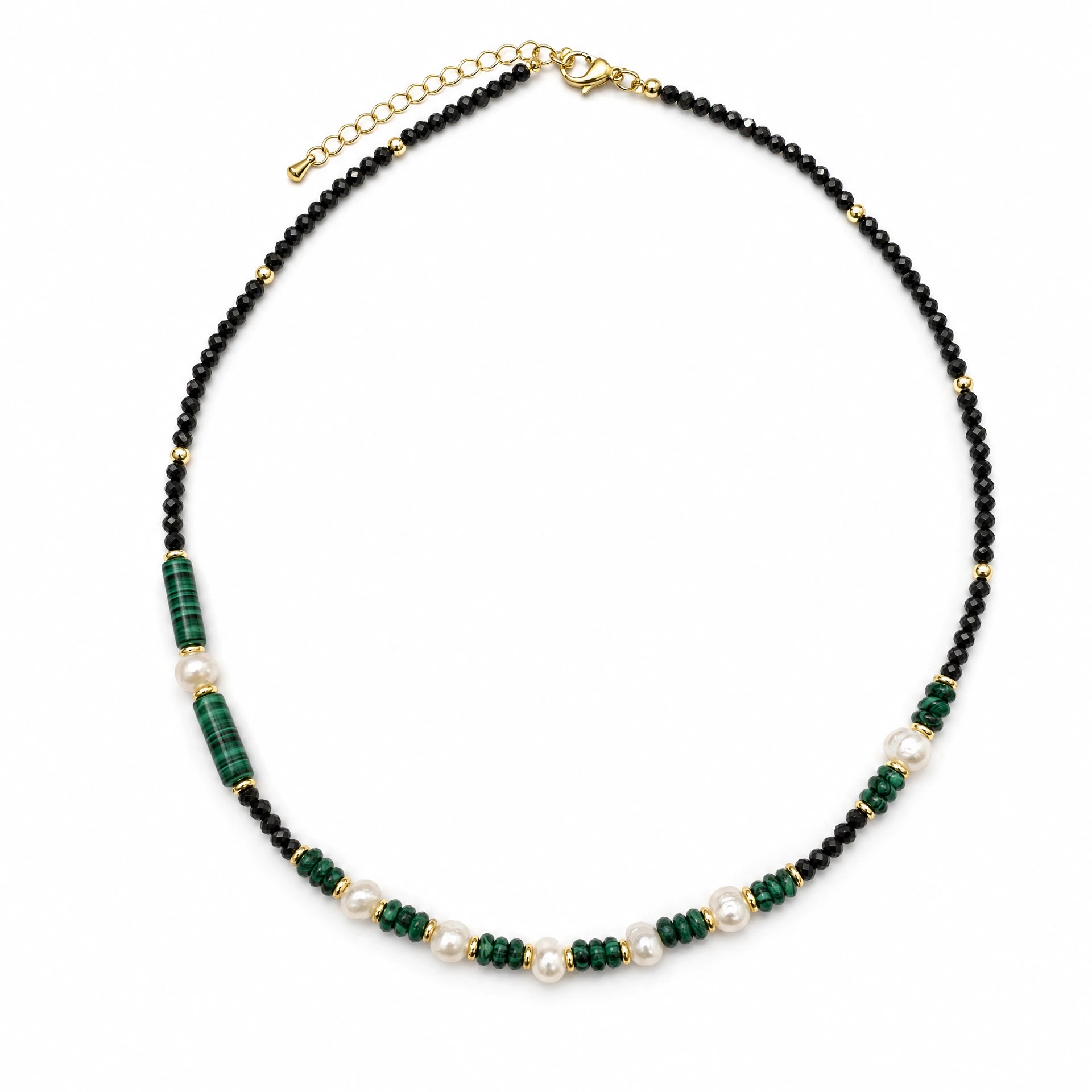Malachite-style black crystal and baroque pearl beaded necklace on a white background