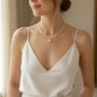 Model wearing gold-tone freshwater pearl halo pendant necklace