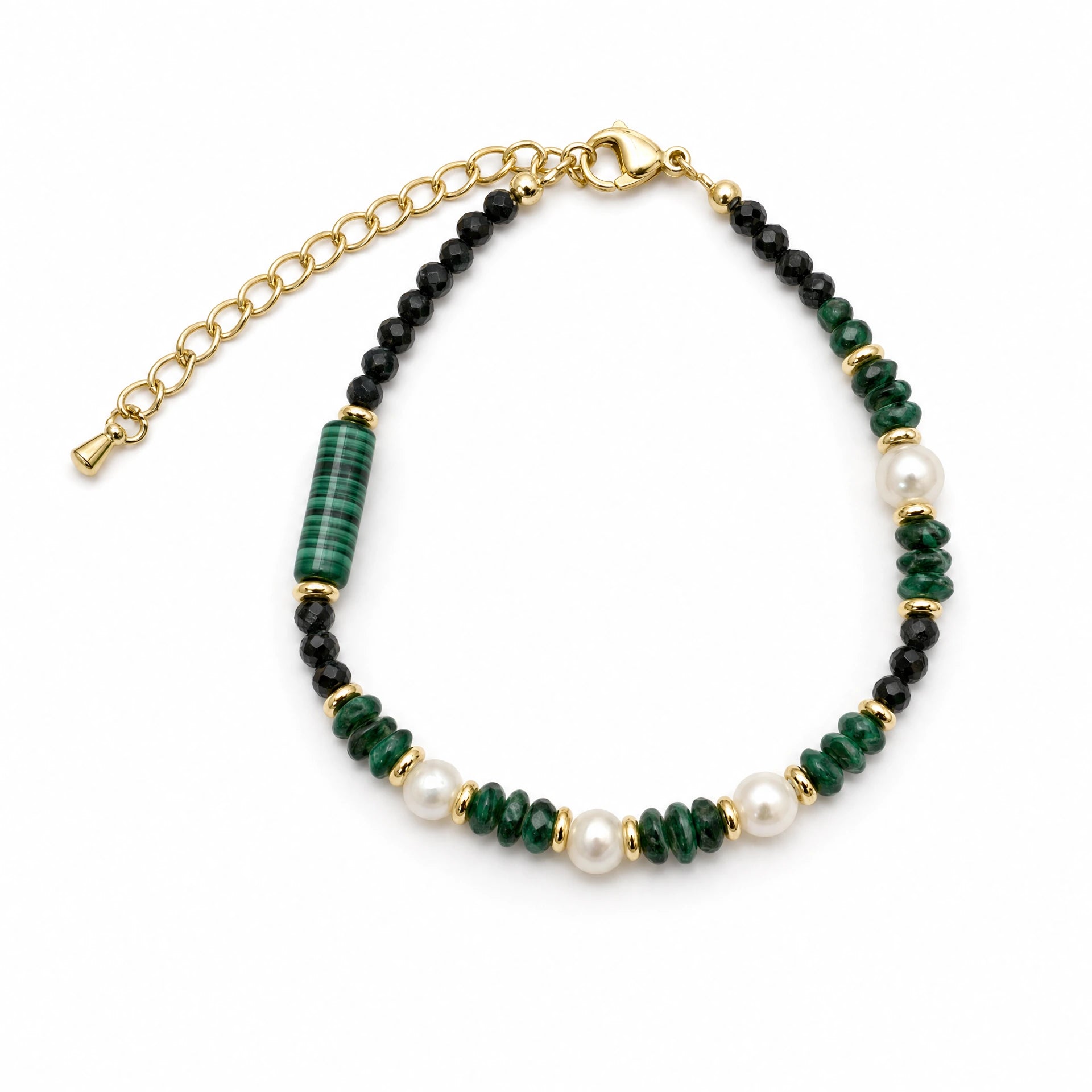 Malachite-style black crystal and baroque pearl beaded bracelet on a white background